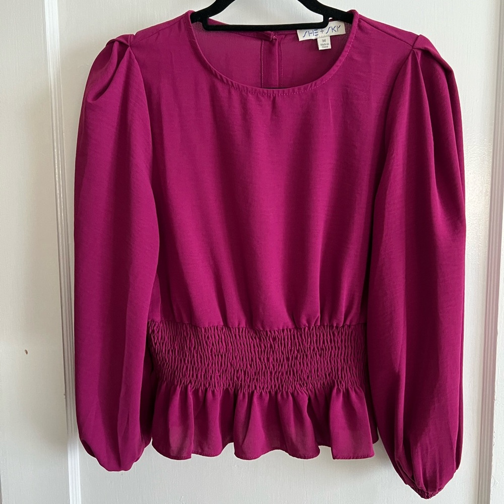 Pink long sleeve blouse with buttons down the back